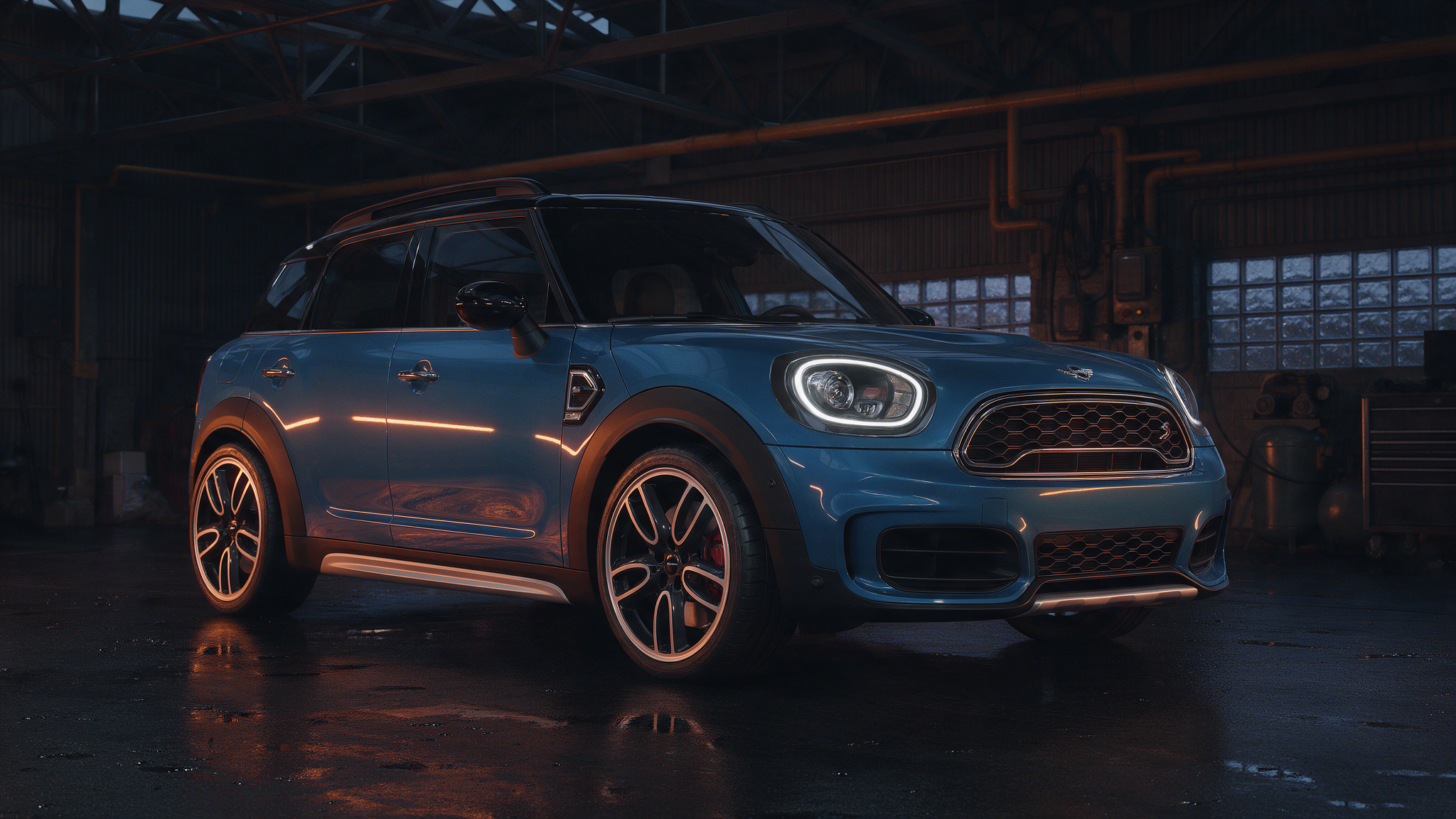 Mini Countryman F60 Cooper S in donkere werkplaats met oranje verlichting