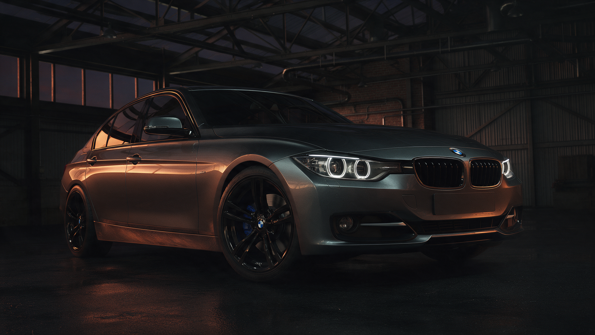 BMW 335i F30 sedan in Mineral Grey in een donkere werkplaats
